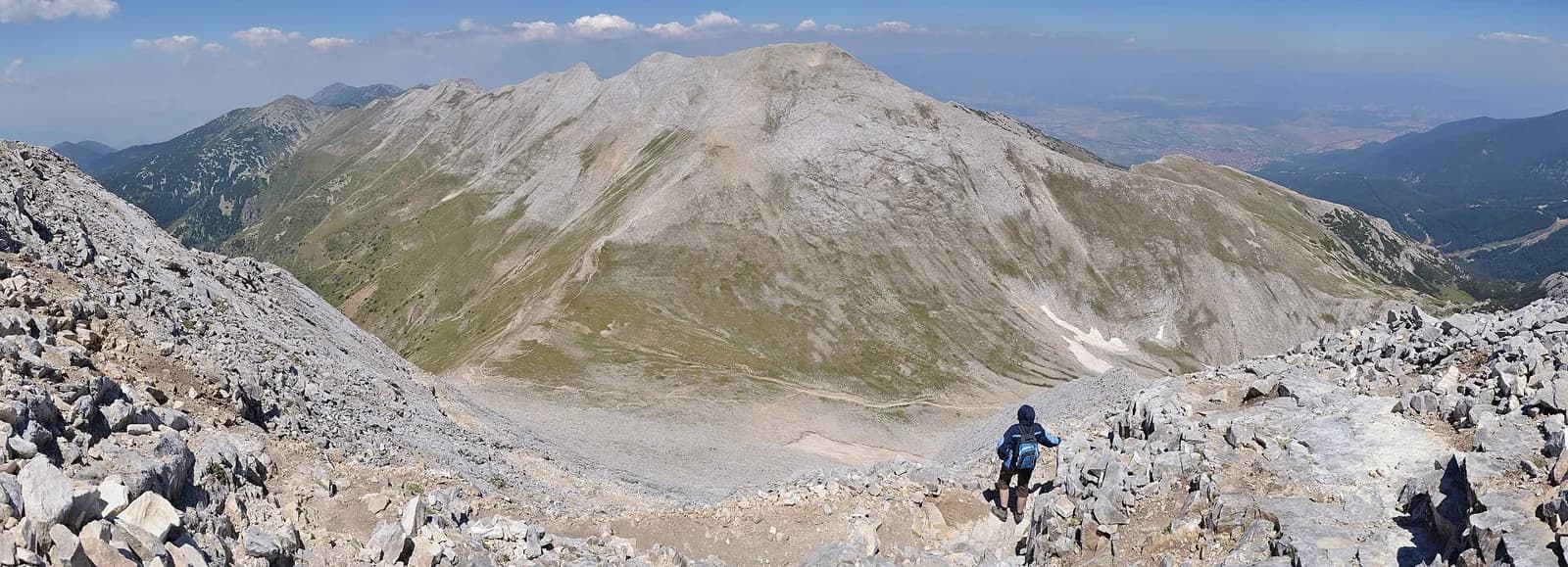 Rocky hiking path and mountain ridges seen from Vihren in Pirin