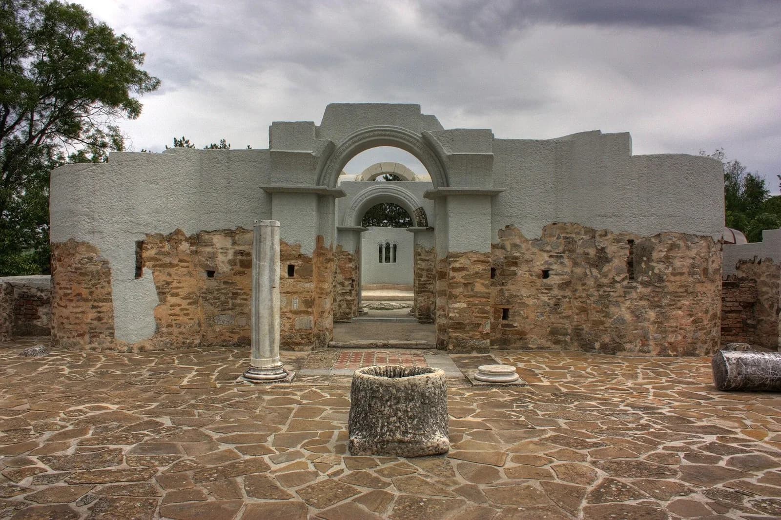 Reconstructed entrance masonry and columns among the Golden Church ruins in Preslav.