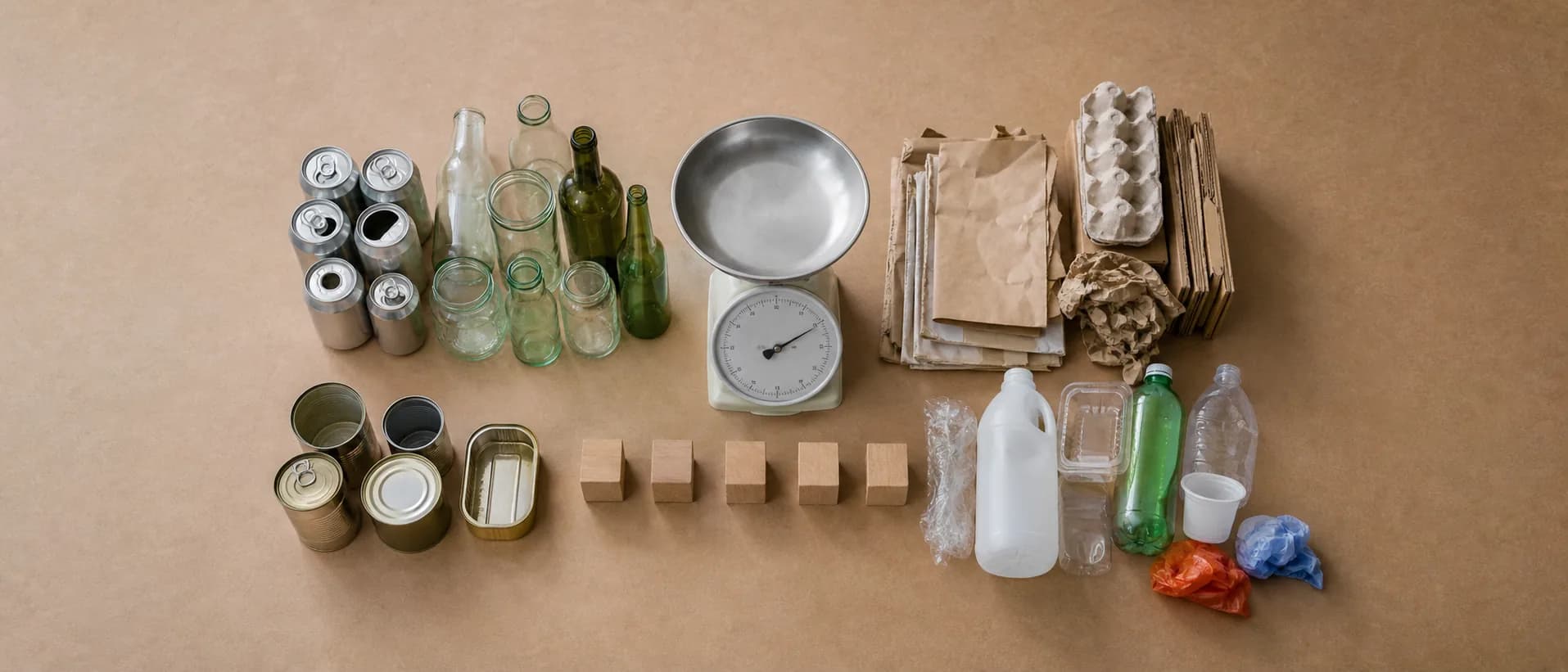 Sorted materials and a scale show why a waste label must match the receiving system.