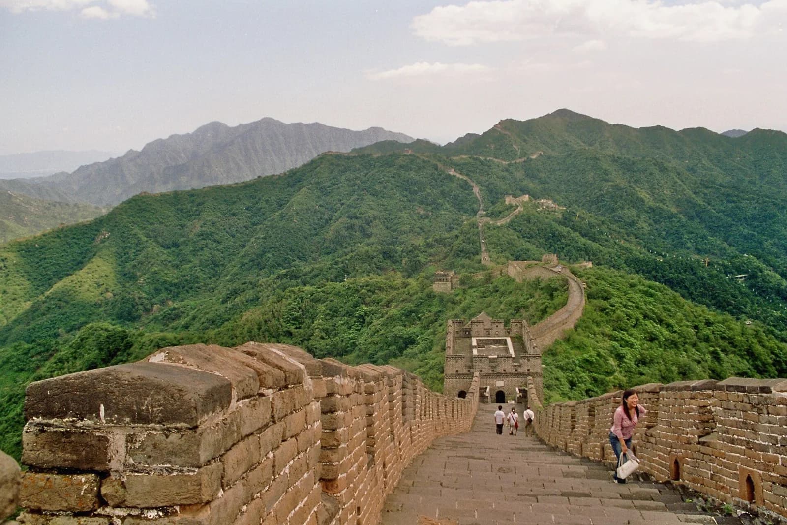 Mutianyu Great Wall and a watchtower among green mountain ridges