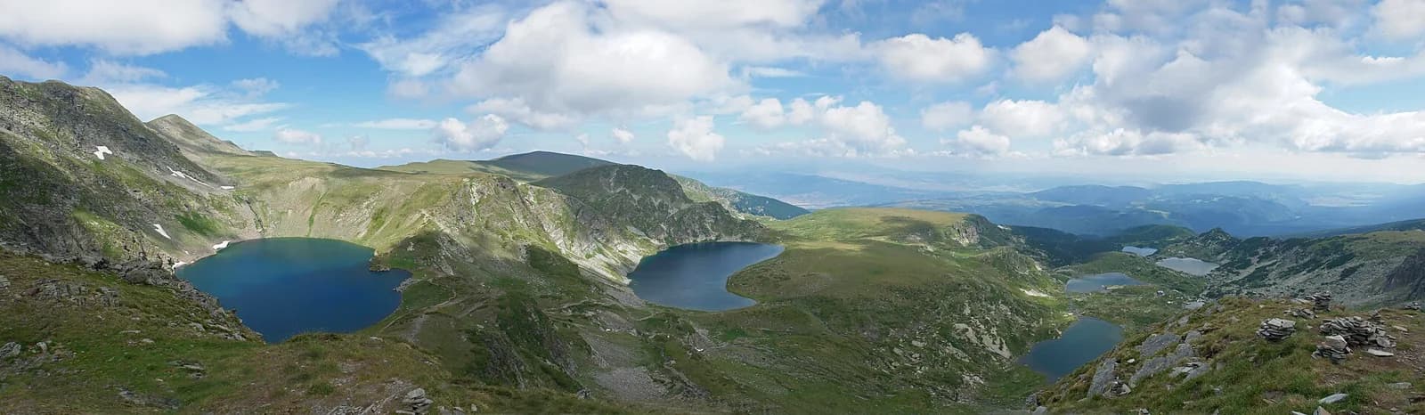 Several of the Seven Rila Lakes between rocky mountain ridges